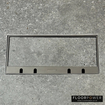Flush Recessed Floor Socket with Old Bronze Surround in grey stone floor