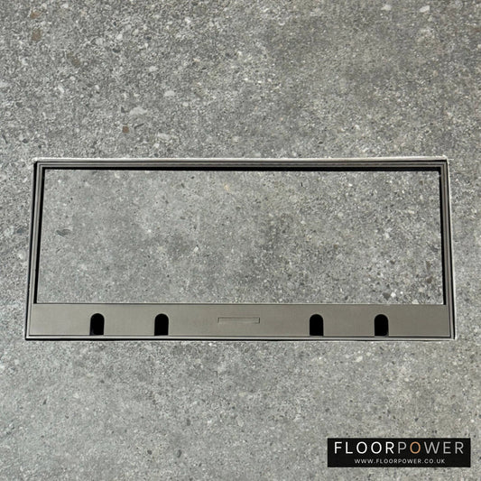 Flush Recessed Floor Socket with Old Bronze Surround in grey stone floor