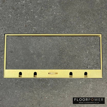 Flush Recessed Floor Socket with Satin Brass Surround in grey stone floor showing the lid handle in the up position