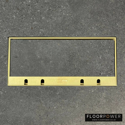Flush Recessed Floor Socket with Satin Brass Surround in grey stone floor