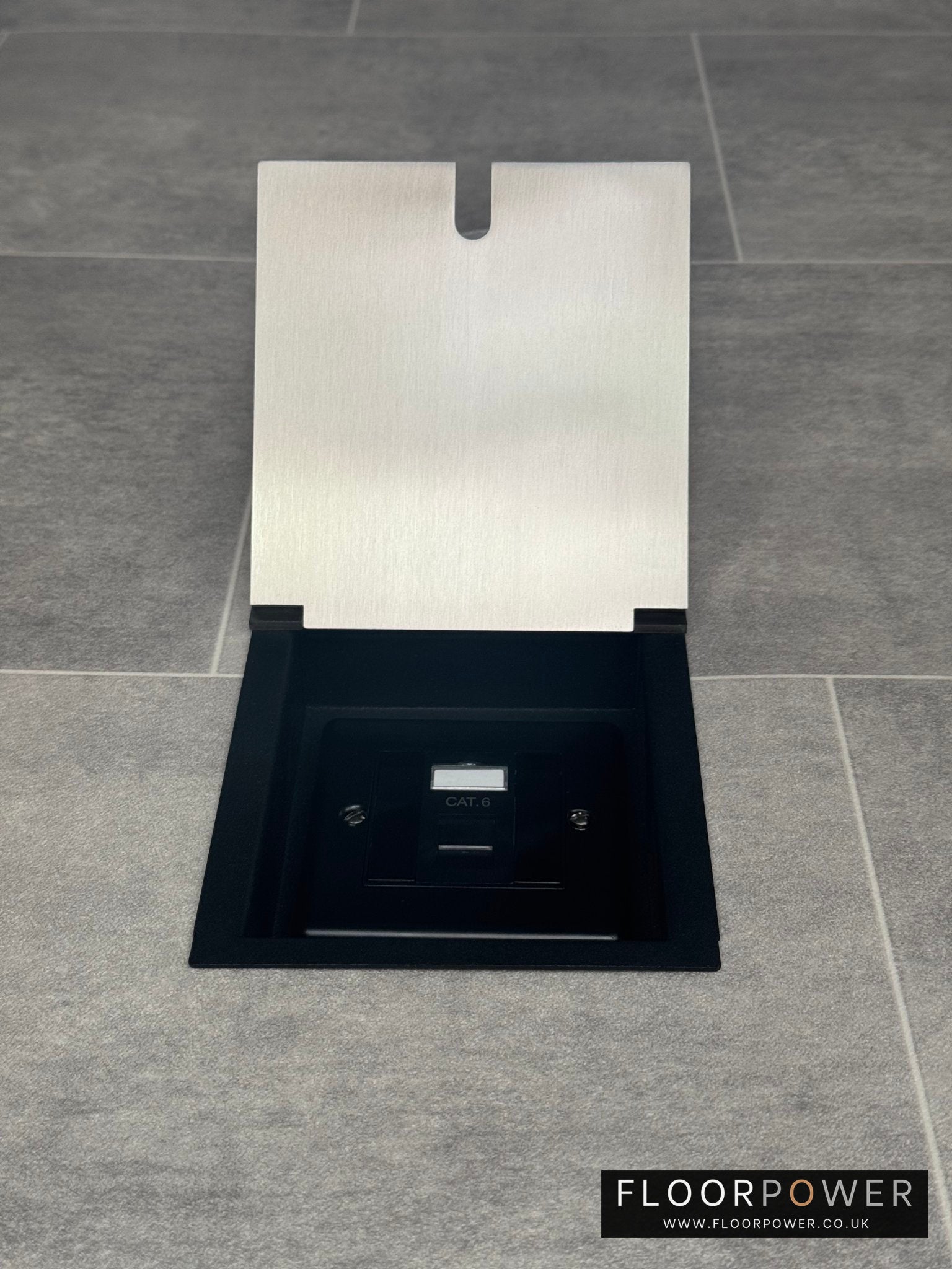 A satin stainless recessed floor socket with a black base, opened to reveal the internal Cat6 RJ45 socket.