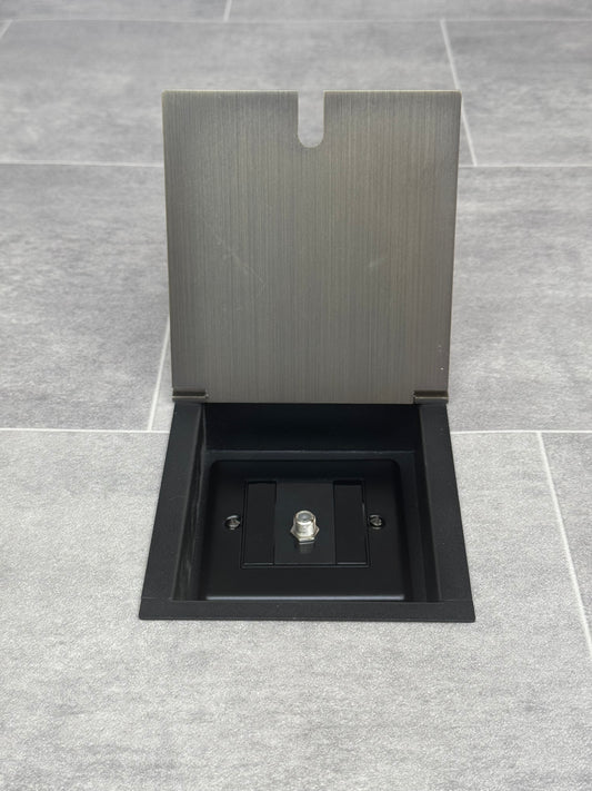 Antique brass recessed floor socket with one satellite F connectors for a single satellite feed.