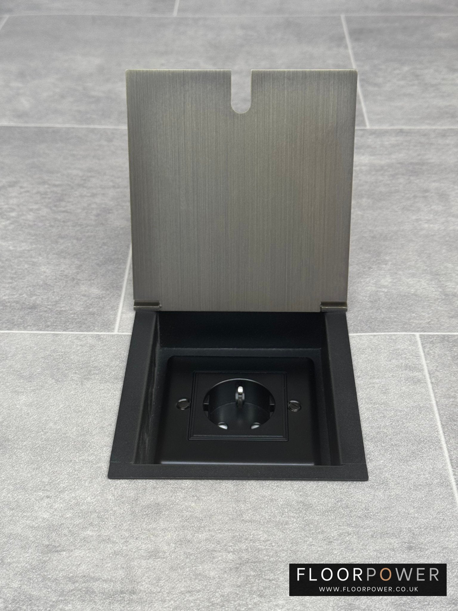 Antique brass recessed floor socket with a single Schuko (European) plug socket.