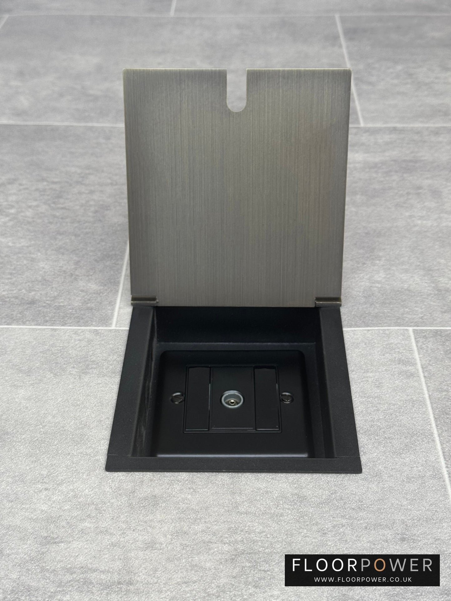 Recessed floor socket in antique brass with a single TV aerial socket.