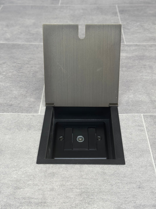 Recessed floor socket in antique brass with a single TV aerial socket.