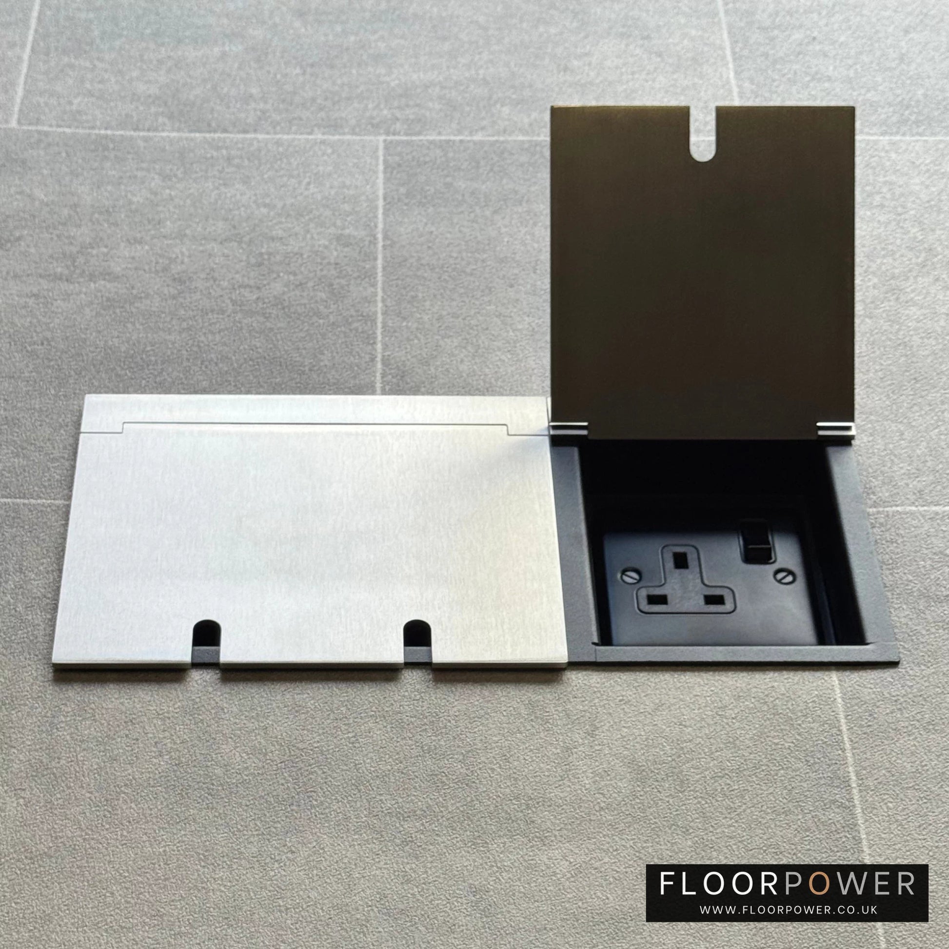 Triple plug floor socket in Satin Nickel with single 13A switched plug socket lid open.