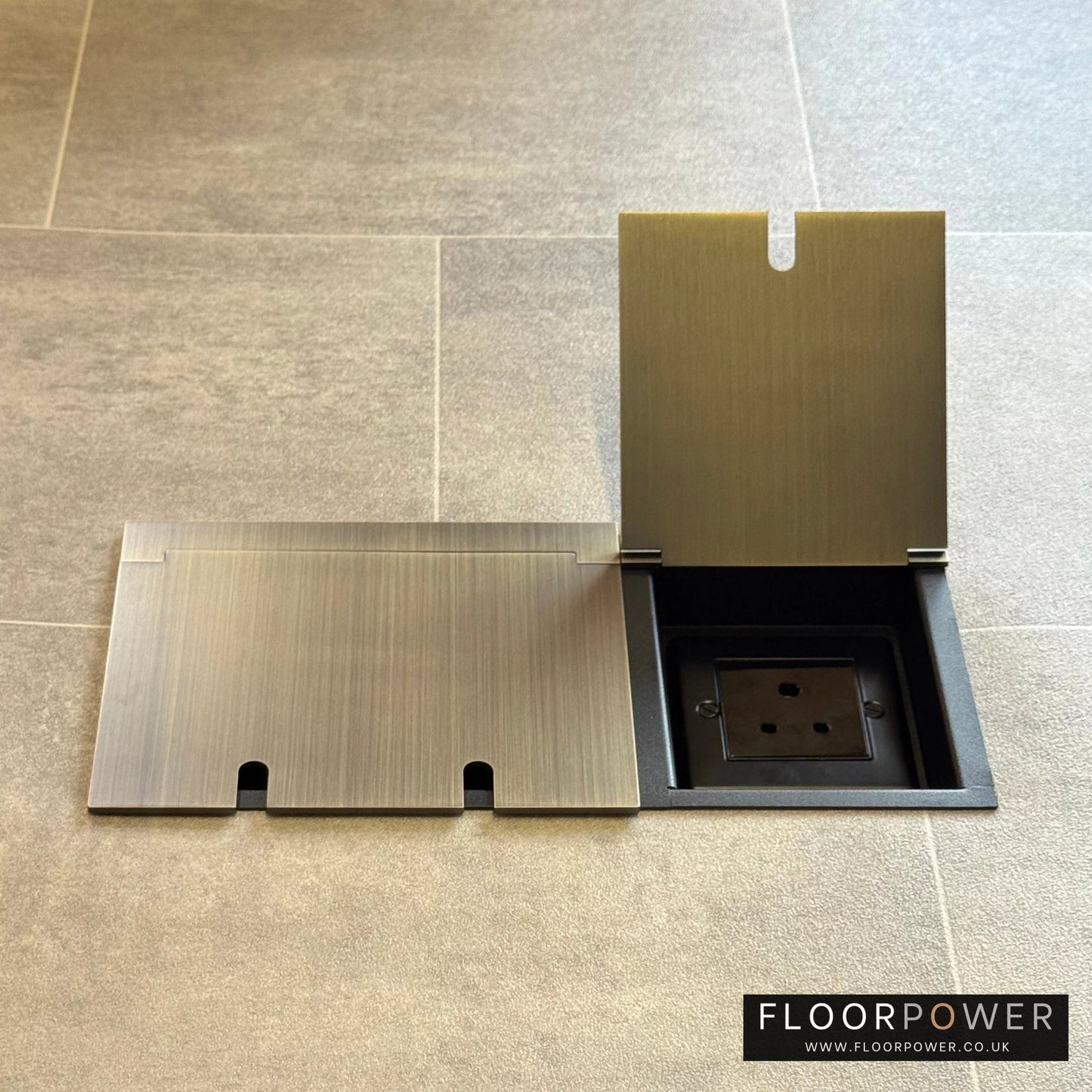 Lighting combination triple floor socket in Antique Brass with 5A round pin socket lid open.