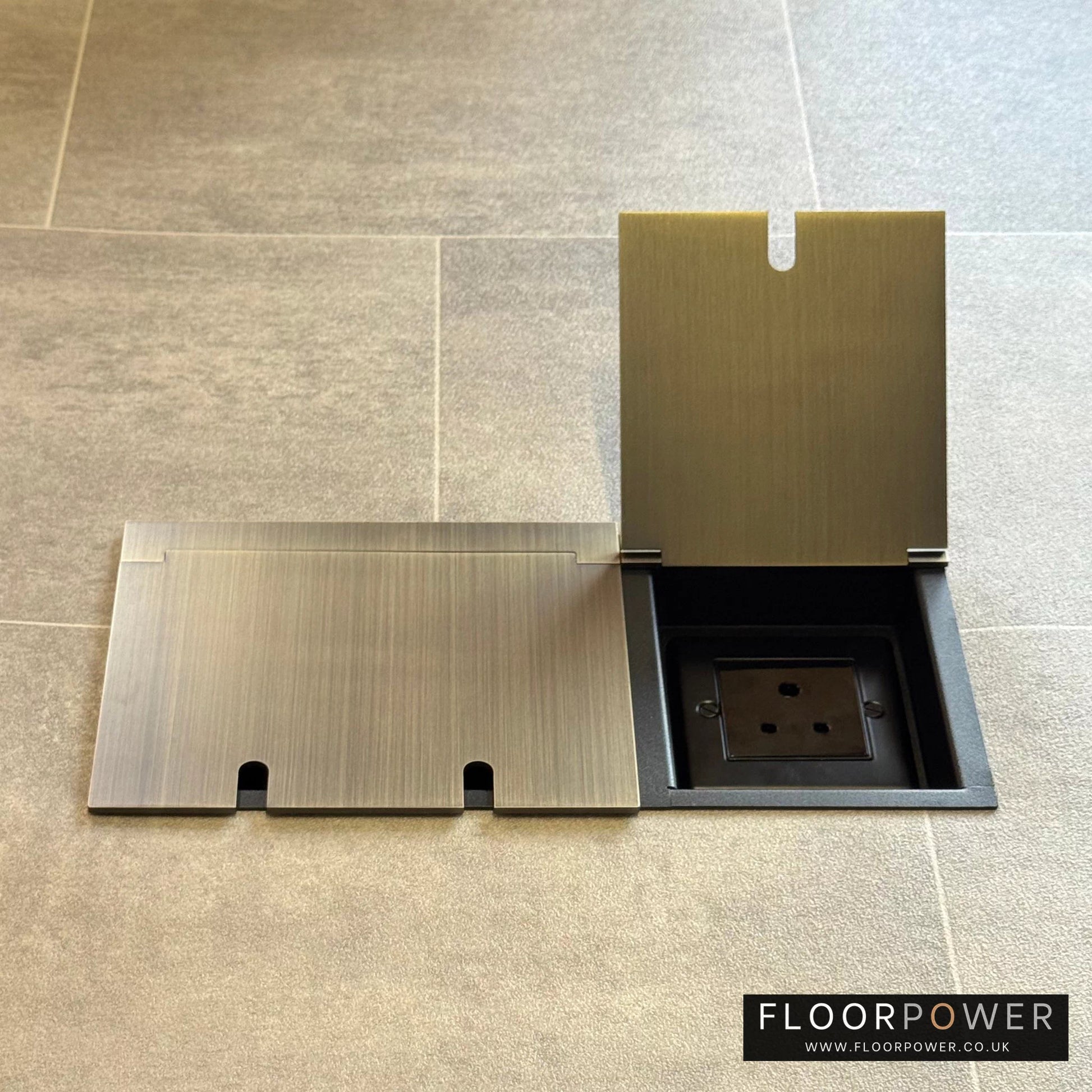 Lighting combination triple floor socket in Antique Brass with 5A round pin socket lid open.