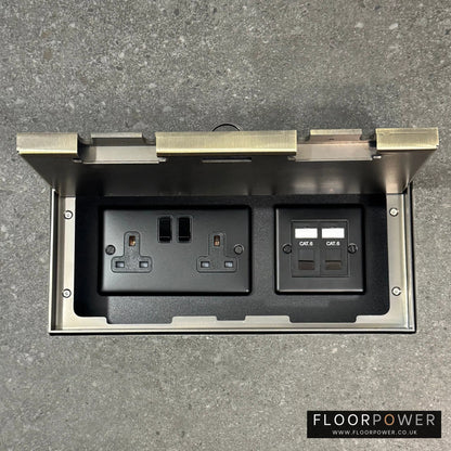 Triple Network Combination Flush Recessed Floor Socket with Antique Brass Surround in grey stone floor