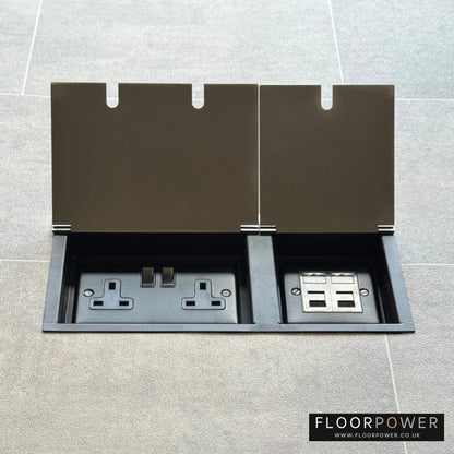 Satin Stainless network combination triple floor socket with double 13A switched plug socket and two RJ45 Cat6 network socket, both lids open.