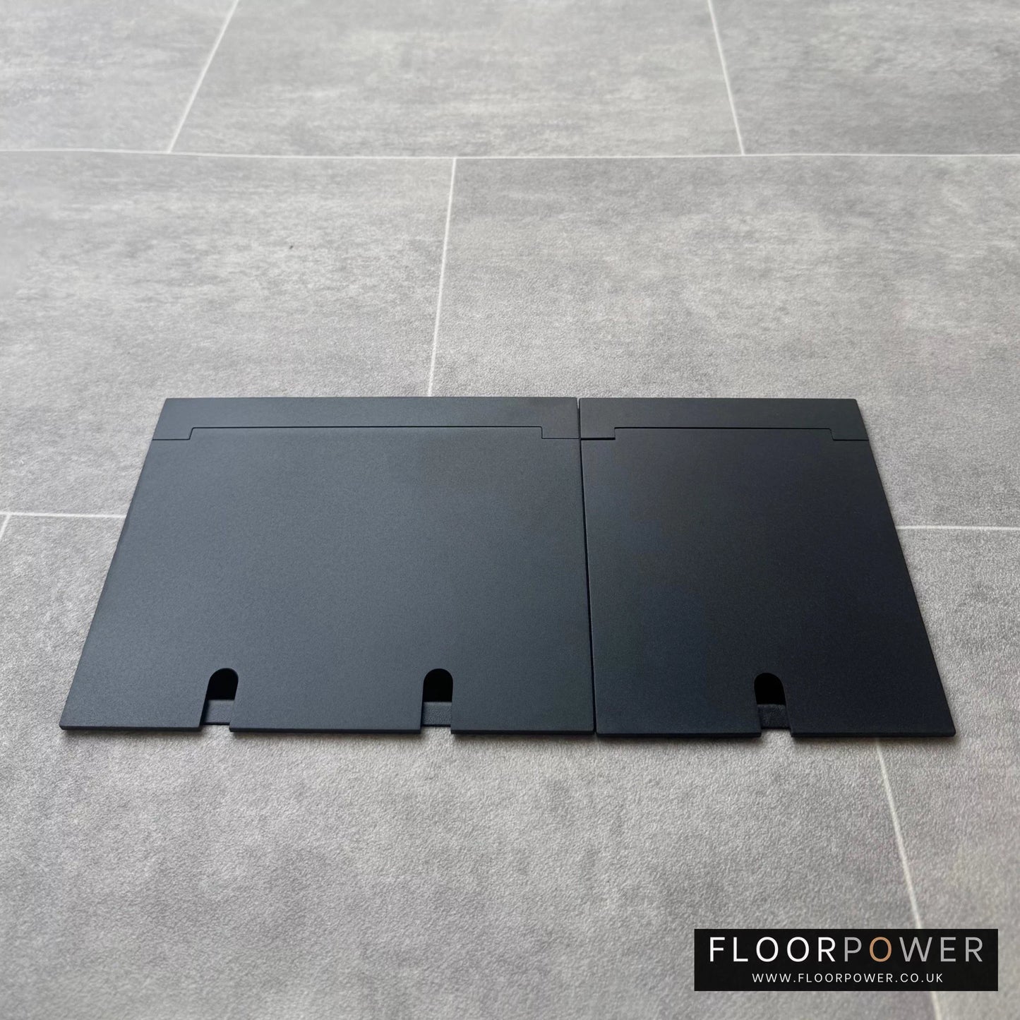Closed Triple Recessed Floor Socket in Matt Black on tiled floor.