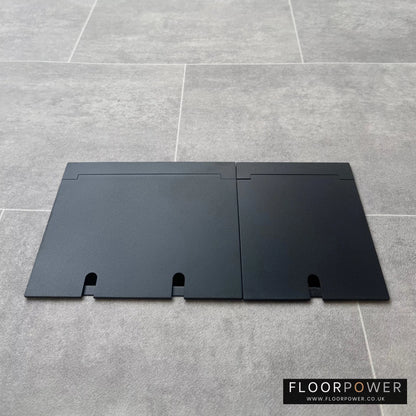 Closed Triple Recessed Floor Socket in Matt Black on tiled floor.