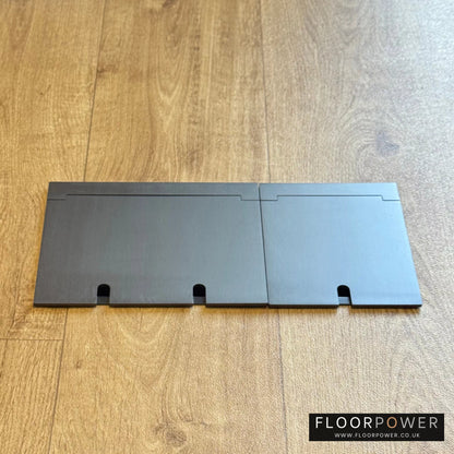 Closed Triple Recessed Floor Socket in Old Bronze on wood floor.