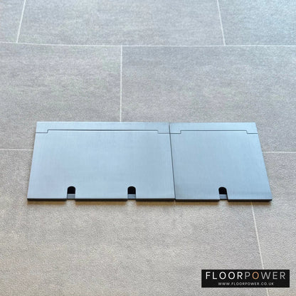 Closed Triple Recessed Floor Socket in Old Bronze on tiled floor.