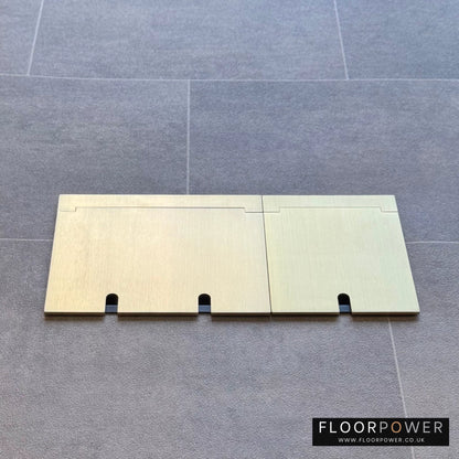 Closed Triple Recessed Floor Socket in Satin Brass on tiled floor.