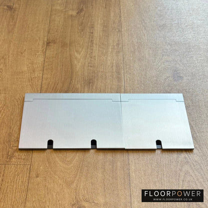 Closed Triple Recessed Floor Socket in Satin Stainless on wood floor.