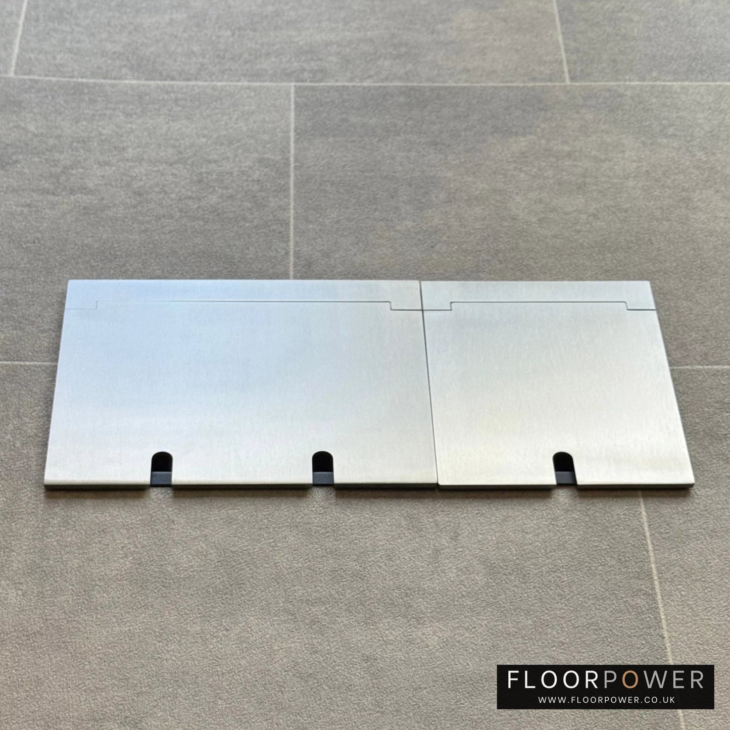 Closed Triple Recessed Floor Socket in Satin Stainless on tiled floor.