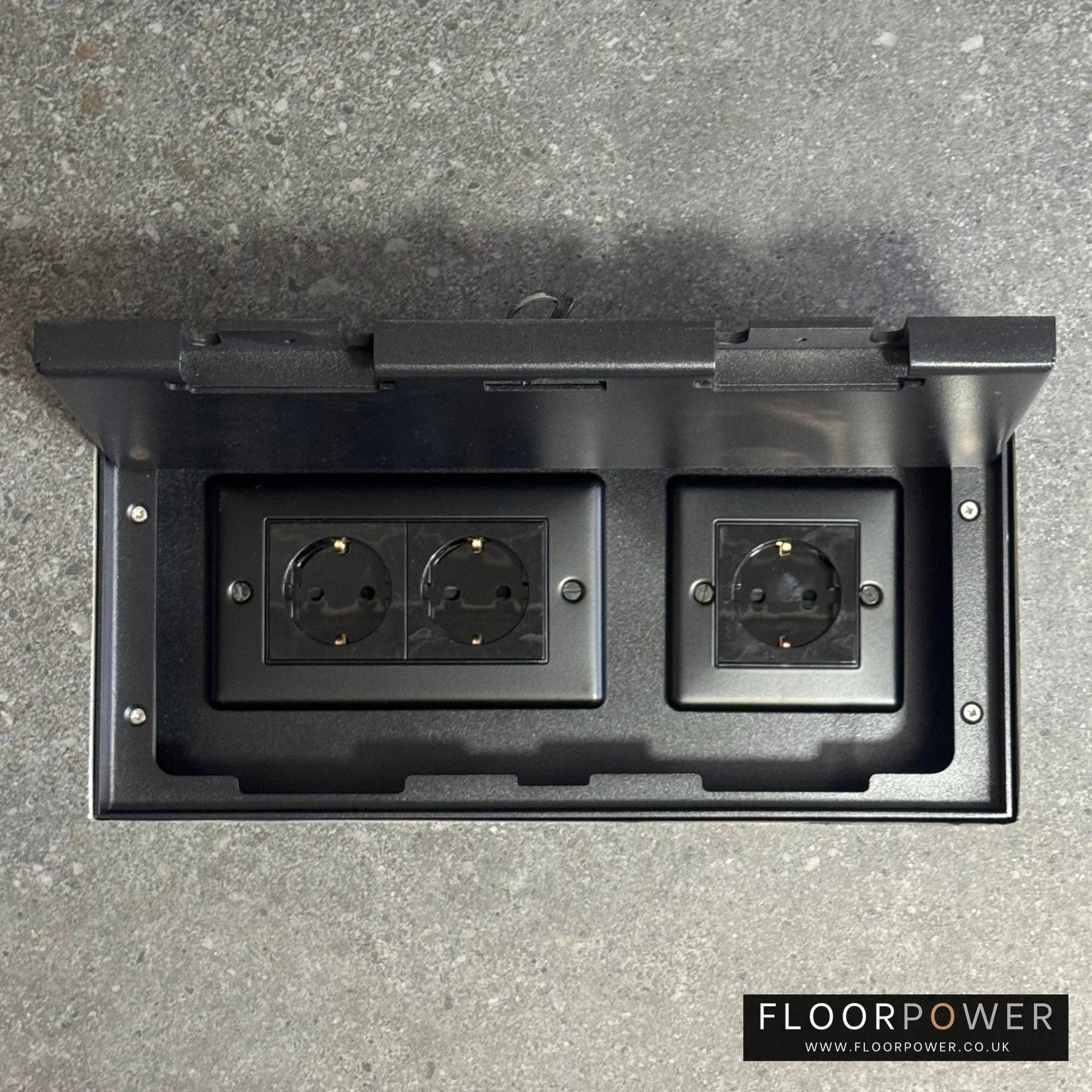 Triple Schuko (European) Plug Socket Flush Recessed Floor Socket with Matt Black surround in grey stone floor
