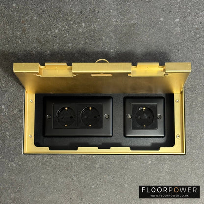Triple Schuko (European) Plug Socket Flush Recessed Floor Socket with Satin Brass surround in grey stone floor