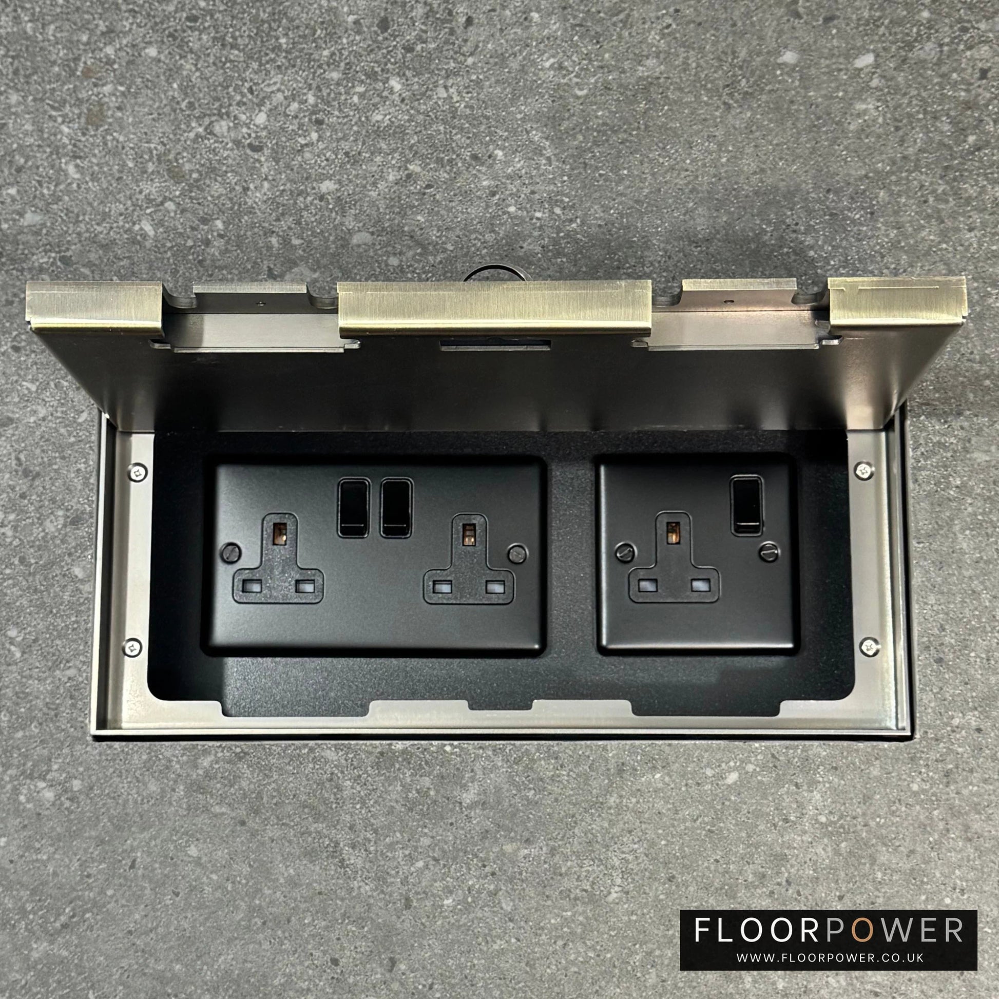 Triple Plug Socket Combination Flush Recessed Floor Socket with Antique Brass Surround in grey stone floor