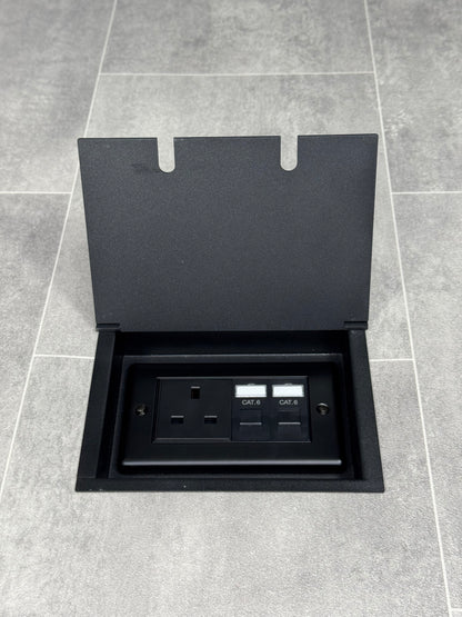 Recessed floor socket in matt black with a double box containing one 13amp unswitched socket and two RJ45 sockets.