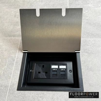 Recessed floor socket in satin nickel with a double box containing one 13amp unswitched socket and two RJ45 sockets, set in a tiled floor setting.