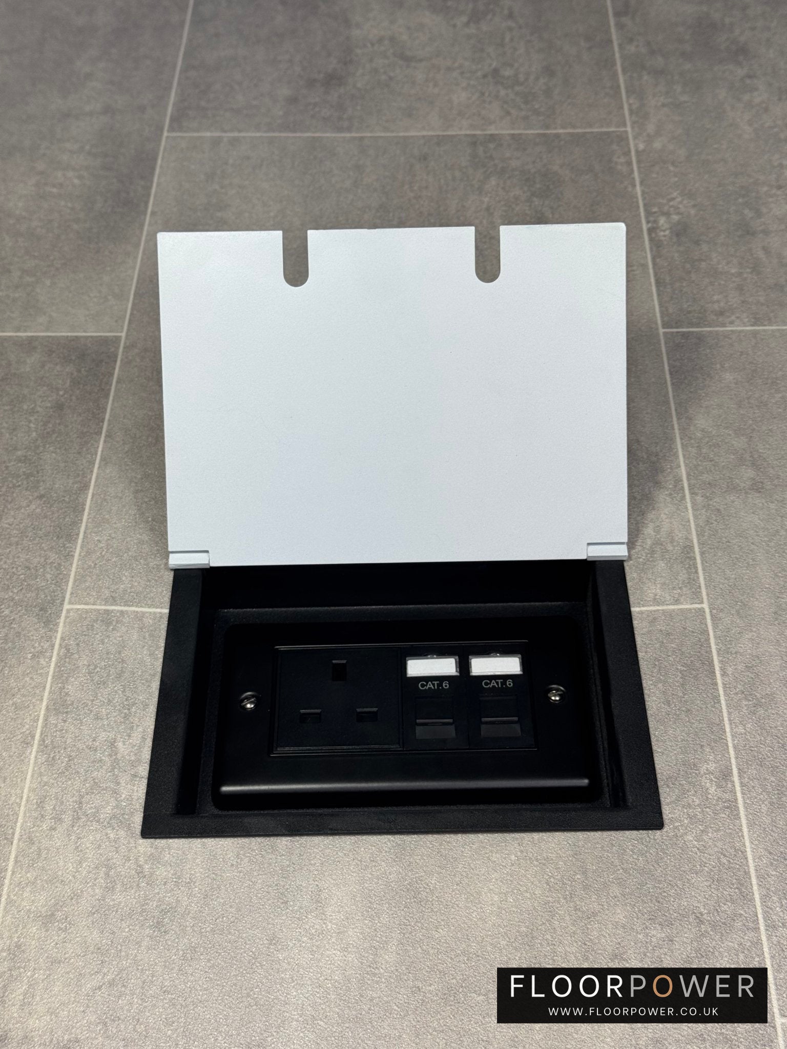 White double recessed floor socket  containing one 13amp unswitched socket and two RJ45 sockets in a tiled floor.